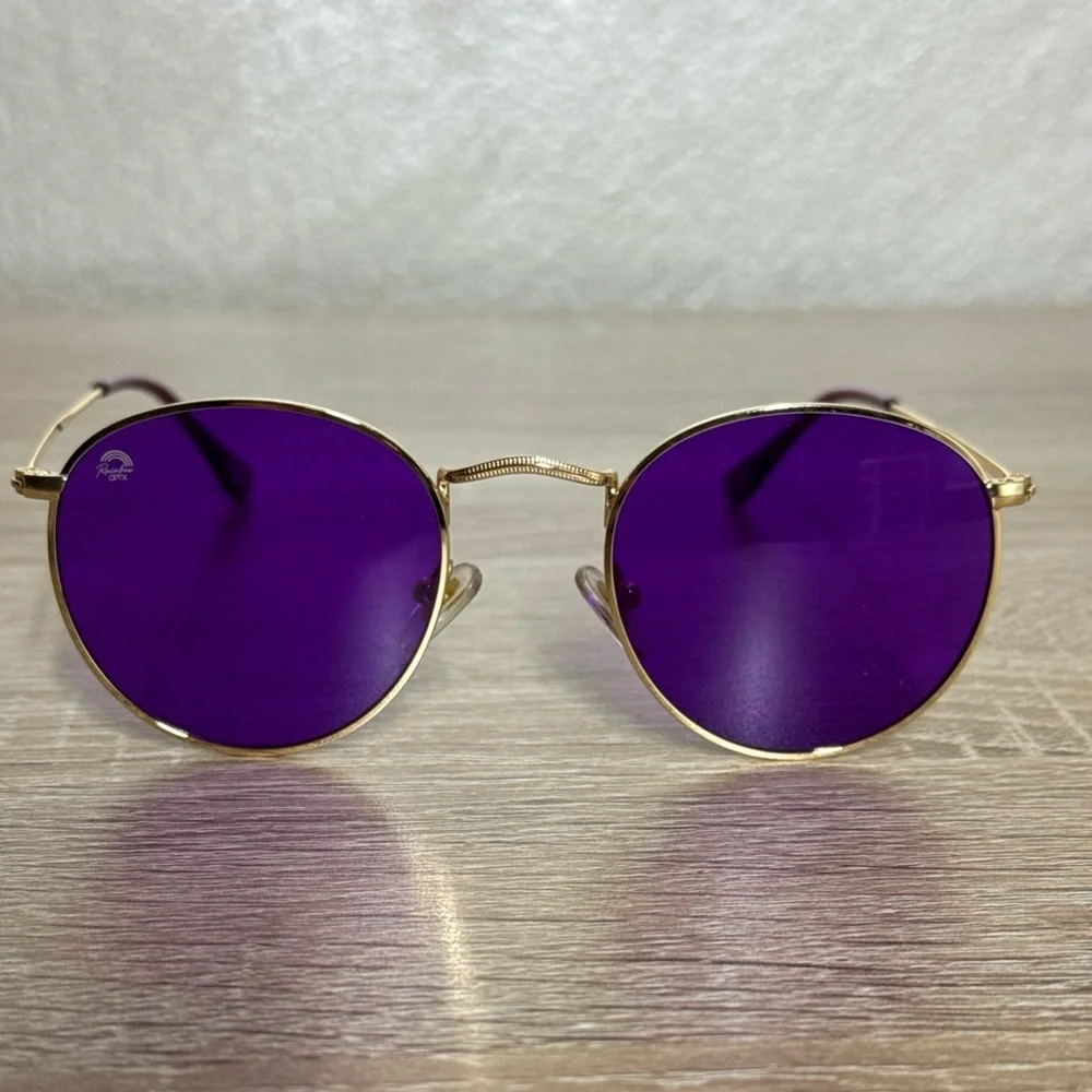 Rainbow OPTX Round sunglasses a gold metal frame and indigo purple lenses